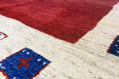 Gabbeh rug 297x202 cm, detail: red geometric pattern with blue cross