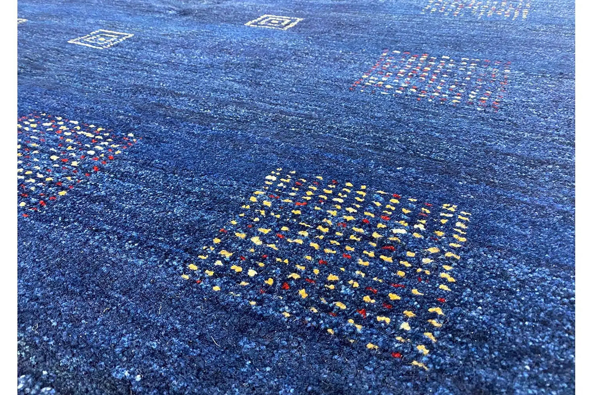 Gabbeh rug: blue background with small multicolored square patterns