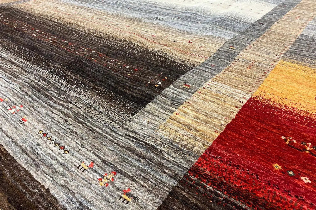 Rug detail with woven stripes in gray, beige, yellow, and red; fine patterns