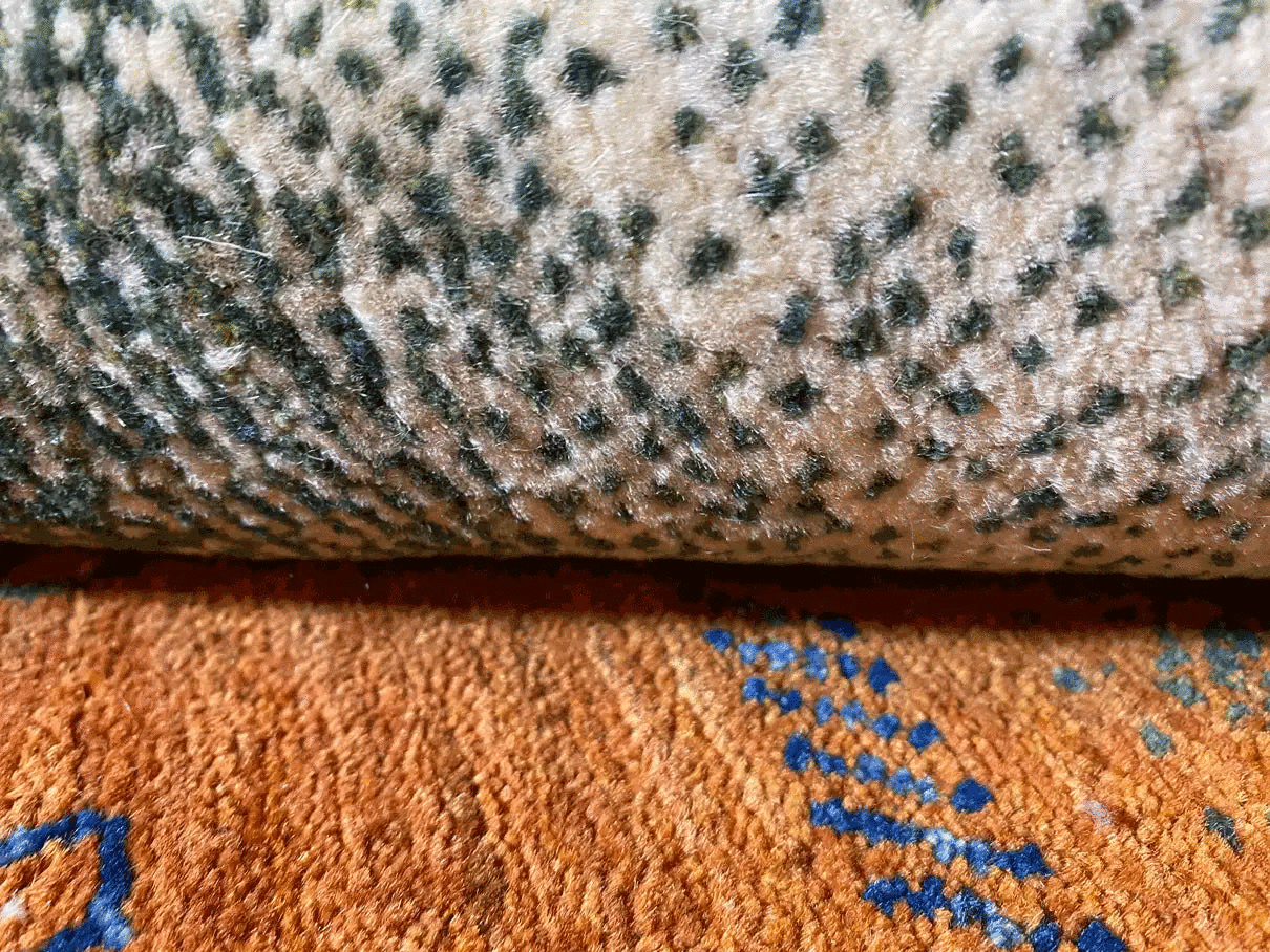 Gabbeh rug with a beige background and dark blue and brown stripes