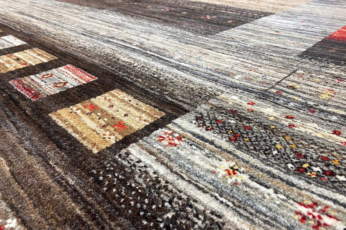 Gabbeh-Lori rug with geometric patchwork in gray, beige, and dark areas