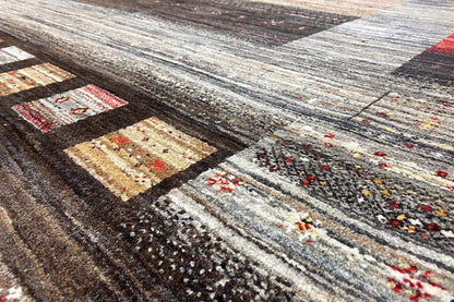 Gabbeh-Lori rug with geometric patchwork in gray, beige, and dark areas