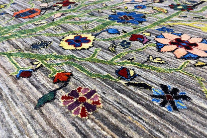 Gabbeh Lori rug with an ornamental tree motif and colorful flowers, close-up