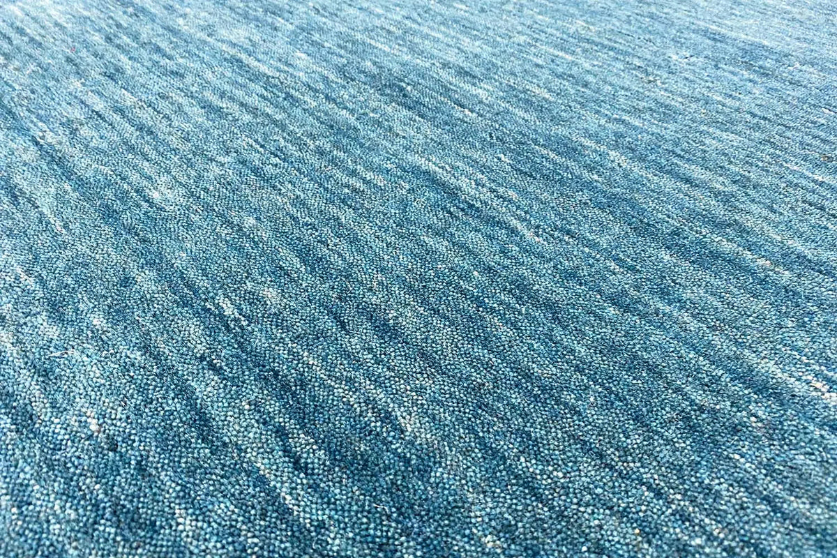 Blue Gabbeh rug with a fine, irregular weave structure