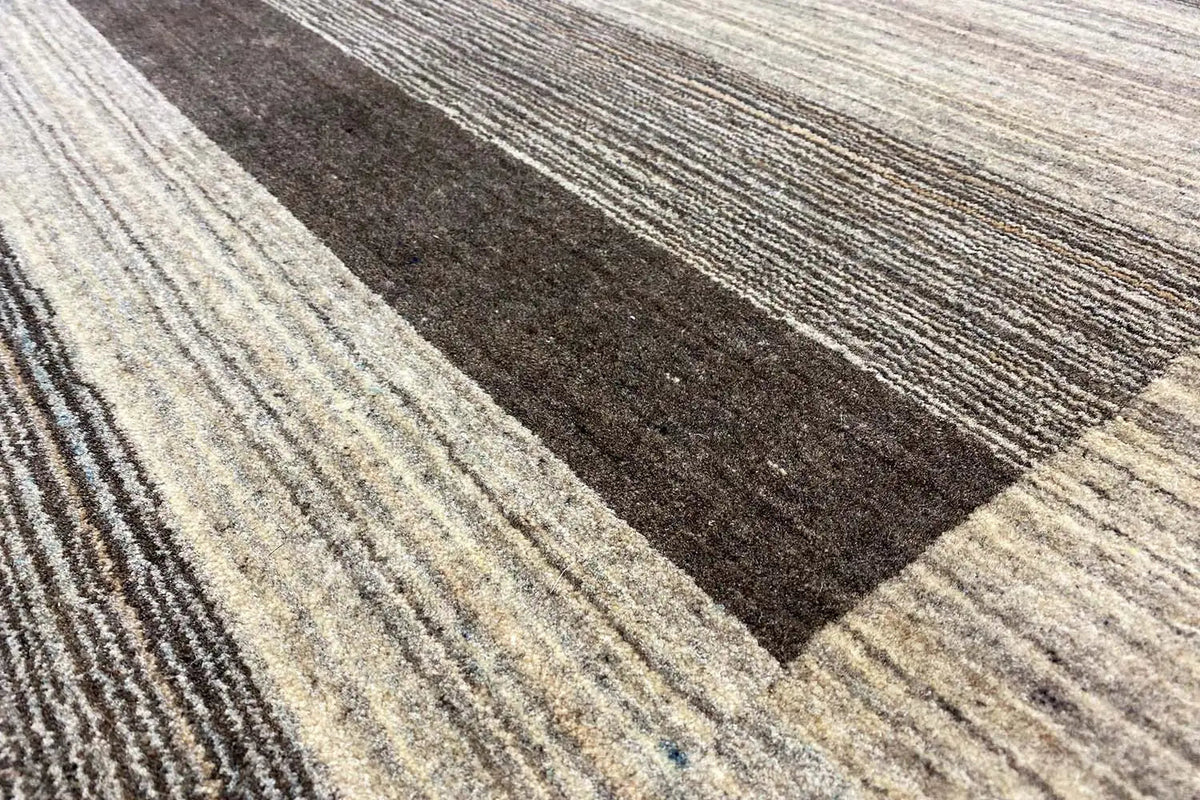 Gabbeh rug pattern: contrasting rectangular stripes in shades of brown, gray, and beige
