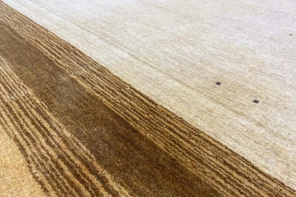 Gabbeh rug, beige low pile with brown stripes, captured from the side