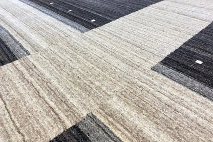 Gabbeh rug with a geometric pattern: light bands and dark zones with dots