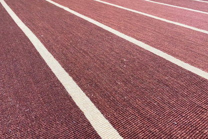 Kilim detail: Wine-red texture with white diagonal stripes
