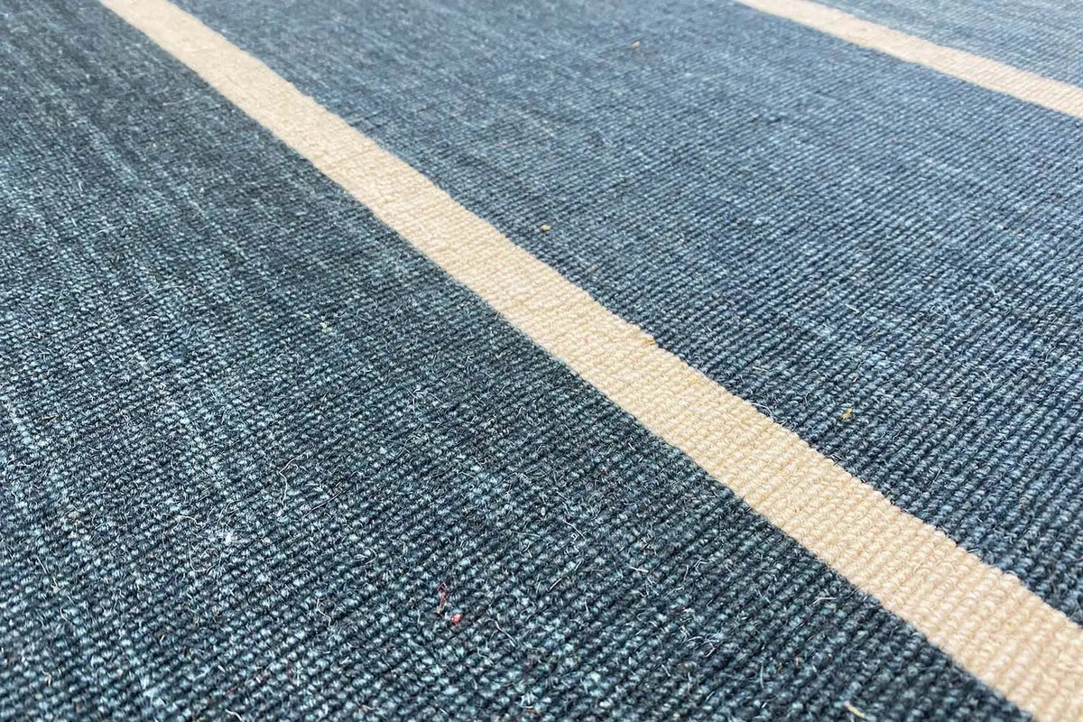 Close-up: kilim weave with a fine texture and light beige stripes