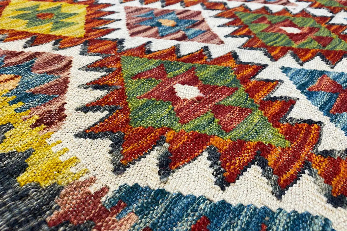 Colorfully patterned kilim runner with geometric motifs in red, blue, green, and yellow