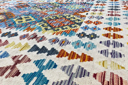 Afghan kilim rug, close-up with colorful geometric patterns