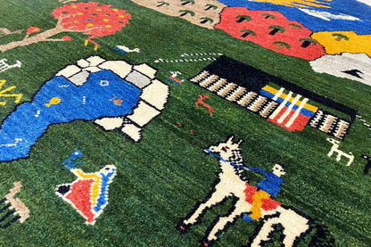Gabbeh rug (96x96 cm), round: green with colorful animal and landscape motifs