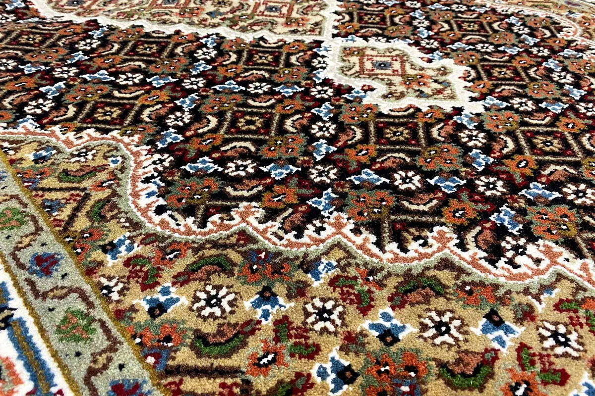 Indo Tabriz rug with a colorful ornamental pattern and dark medallions