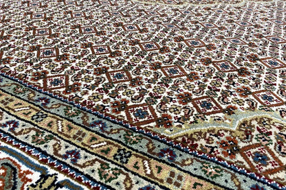 Indo Tabriz rug with ornamental pattern and border, beige with dark blue, red, and green