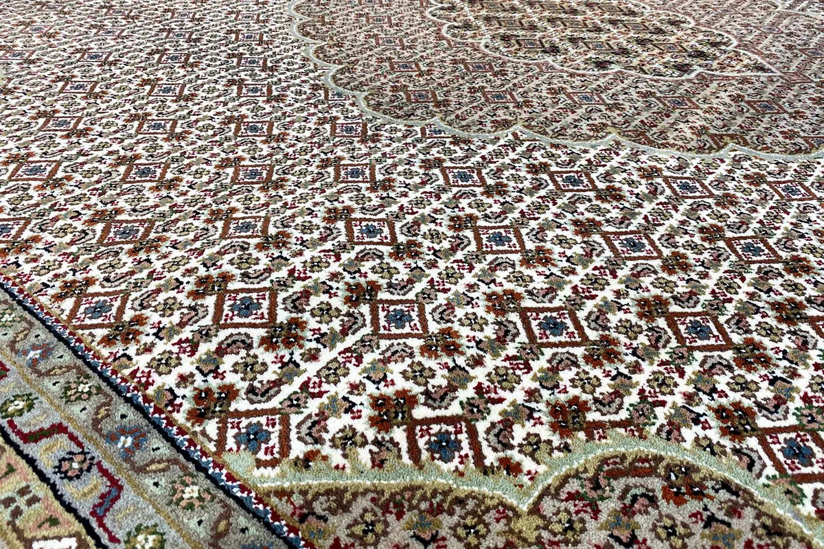 Indo Tabriz rug with multicolored pattern and border, close-up view