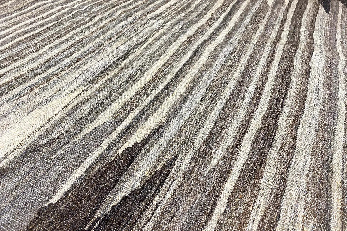 Kilim rug with gray, beige, and black striped pattern