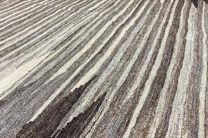 Kilim rug with gray, beige, and black striped pattern