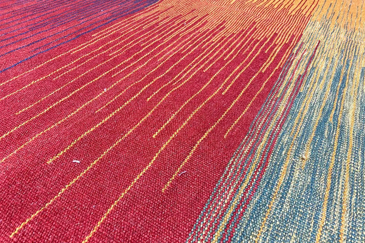 Kilim rug with red, yellow, and blue stripes, densely woven surface