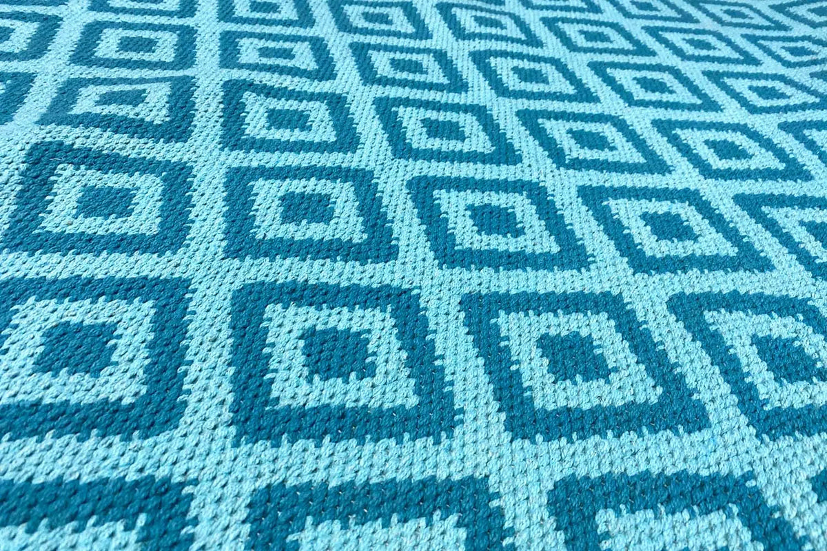 Blue kilim with a square diamond pattern and contrasting light blue lines