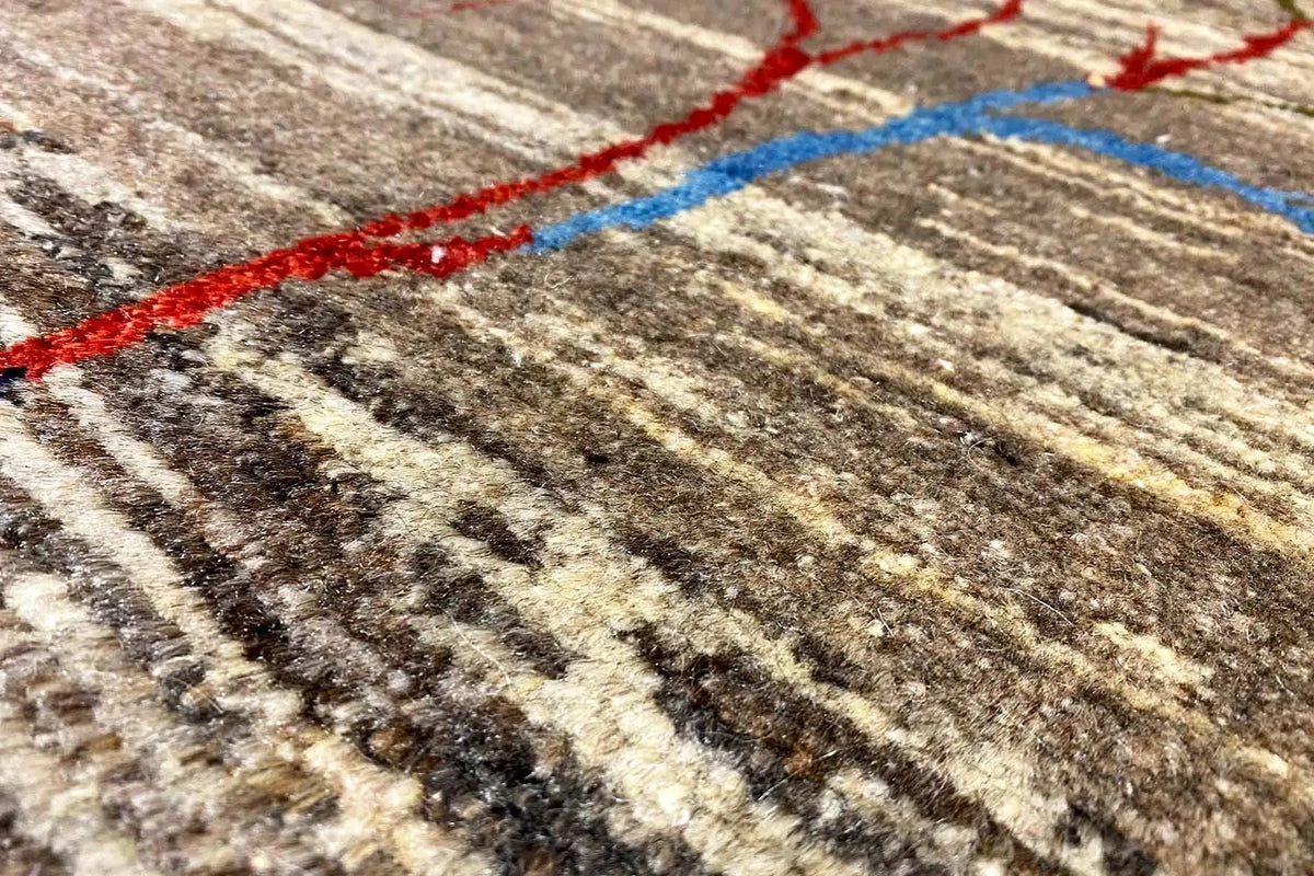 Gabbeh Lori rug with a red-and-blue tree motif and a brown-and-beige striped pattern