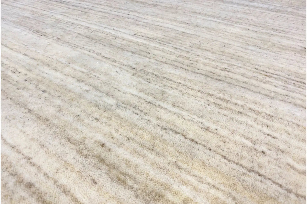 Gabbeh rug 200x303 cm in light beige with a fine linear pattern, close-up of the texture