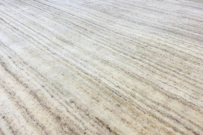 Close-up: beige Gabbeh loom rug with fine lines in the weave pattern