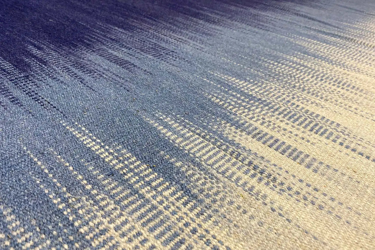 Modern striped kelim dhurrie rug in blue and light beige