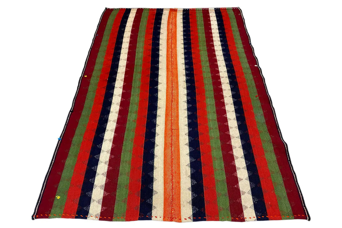 Jajim rug viewed from above at an angle; multicolored vertical stripes, hemmed edge.