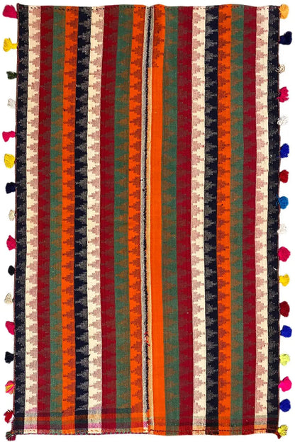 Rectangular Jajim rug with vertical stripes and colorful tassels at all four corners.