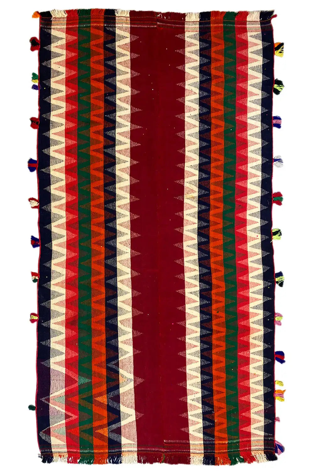 Rectangular jajim rug with vertical stripes in red, cream, green, and blue, tassels