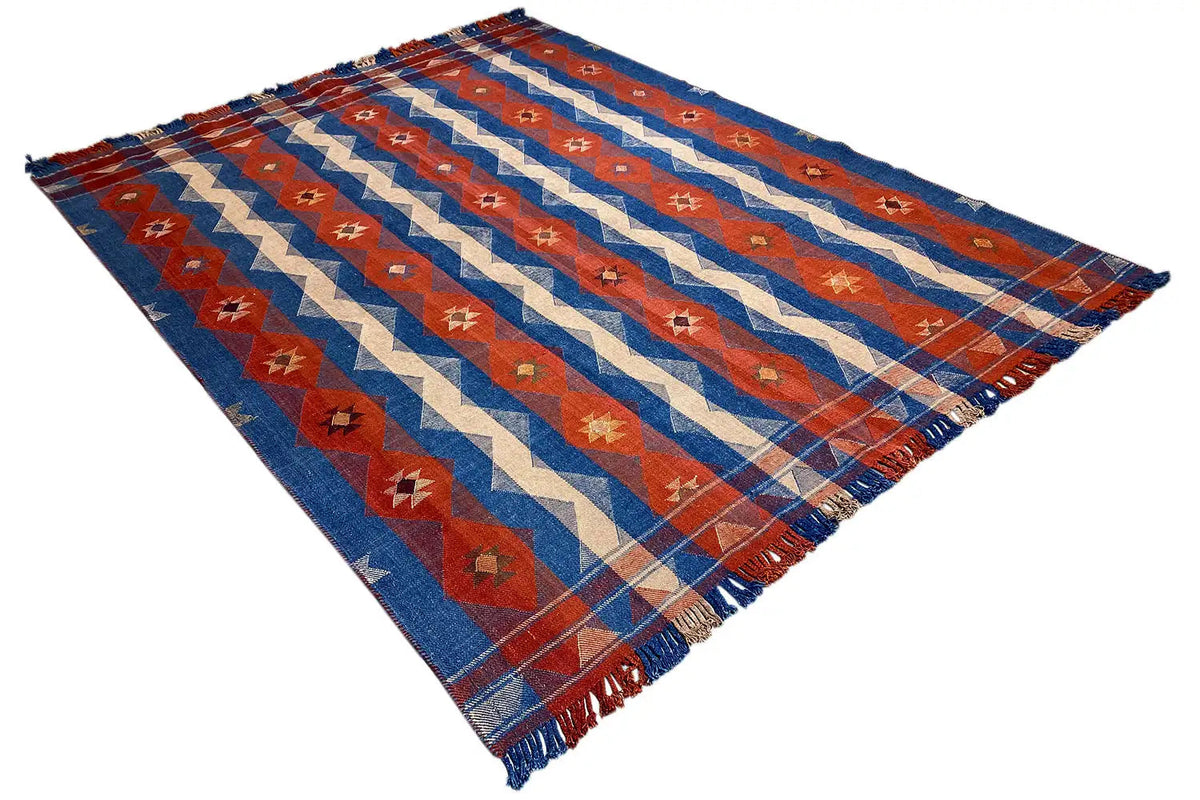 Jajim Exclusive rug 191x254 cm, diagonal view, blue-red-cream pattern, printed look, fringes