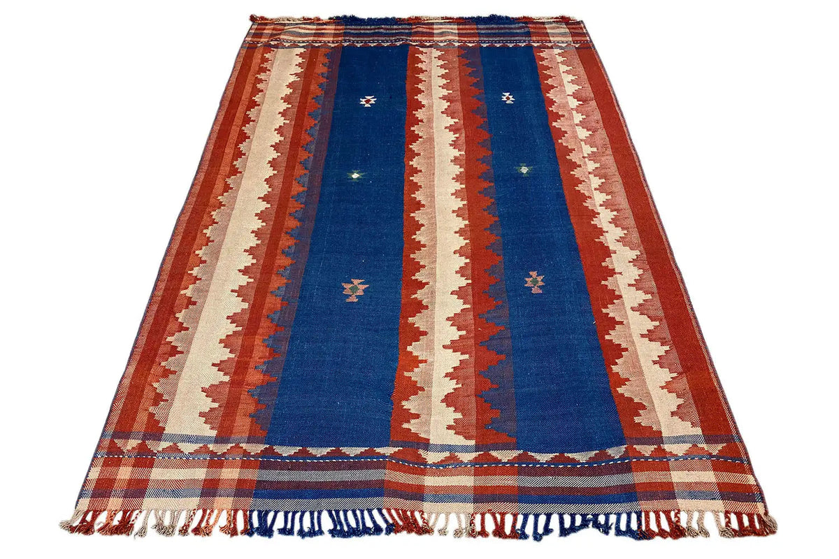 Carpet in a reclining figure shape with a blue central stripe and fringes along the edges