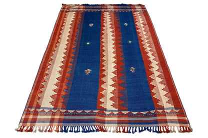 Carpet in a reclining figure shape with a blue central stripe and fringes along the edges