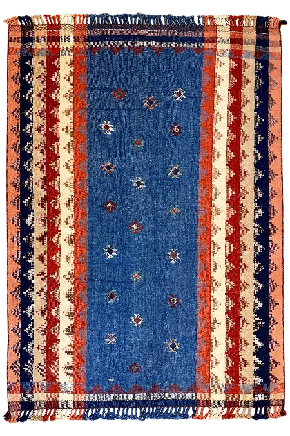 Rectangular rug in terracotta and blue with a striped pattern and fringes