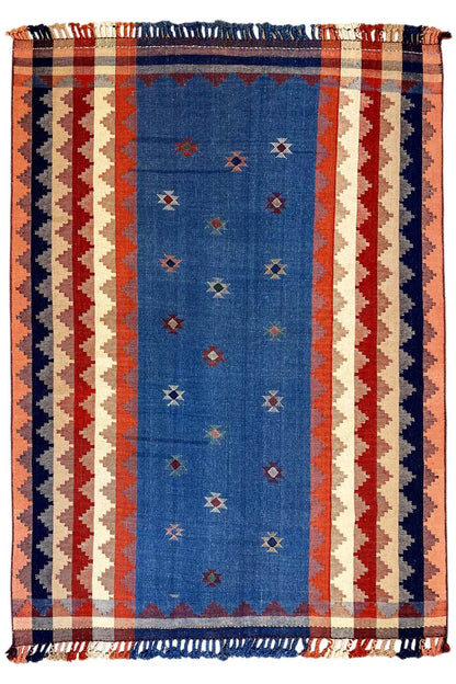 Rectangular rug in terracotta and blue with a striped pattern and fringes