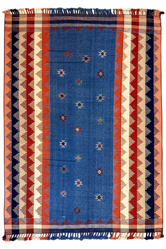 Rectangular rug in terracotta and blue with a striped pattern and fringes