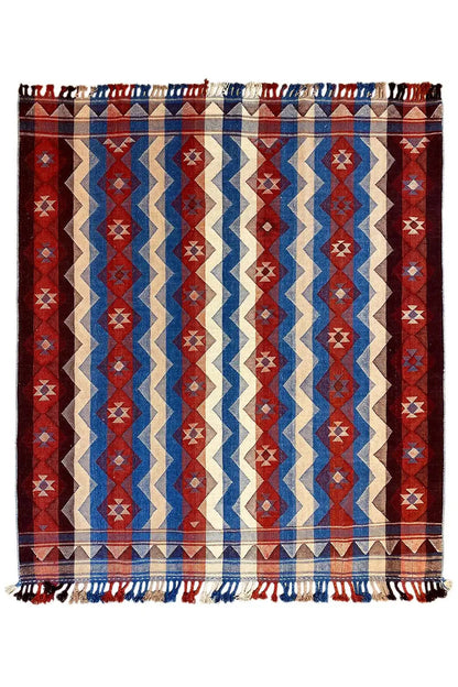 Jajim rug with a geometric zigzag and diamond pattern in red, blue, and cream