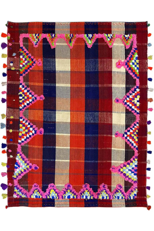 Colorful Jajim rug square with a checked center and decorative tasseled border