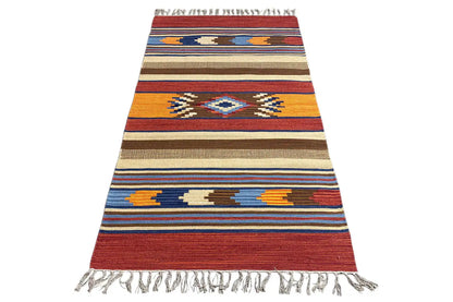 Kilim runner with a geometric striped pattern, fringes, multicolored
