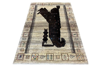 Gabbeh rug with a lion motif, black border, and geometric edging