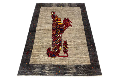 Gabbeh rug with a lion motif on a beige field, dark border, multicolored