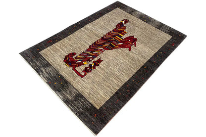 Gabbeh rug with running lion figure, beige field, dark border with colorful dots