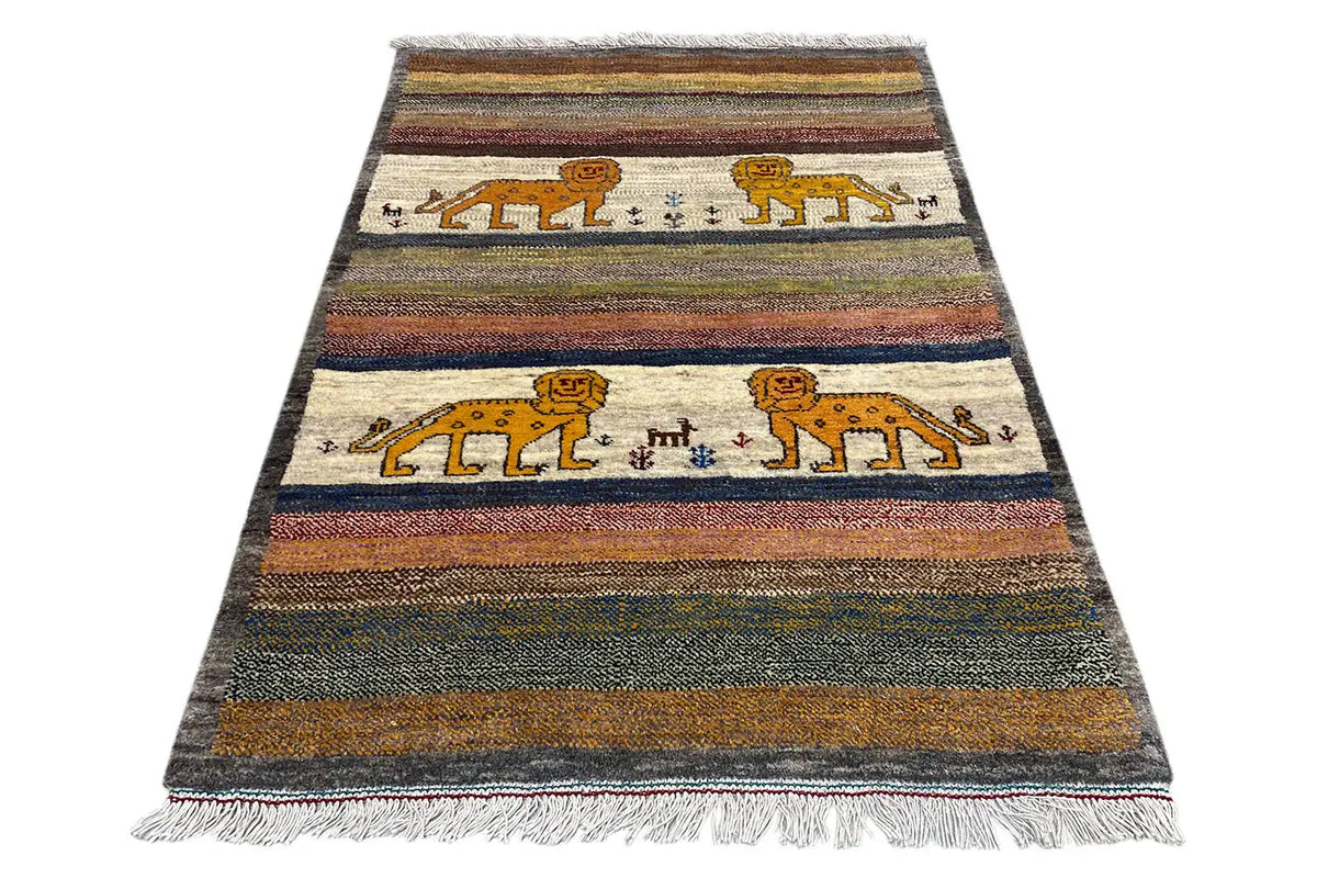 Rectangular Gabbeh rug with striped pattern and two lion figures, frayed edges