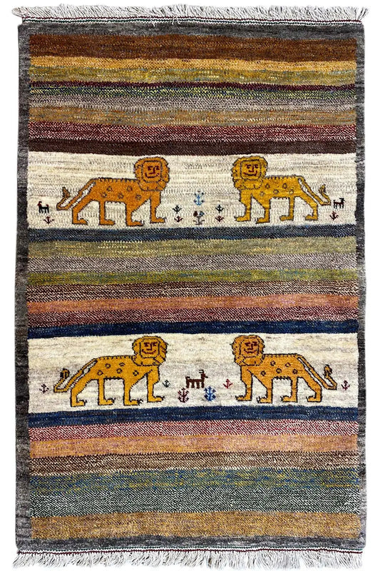 Gabbeh rug with multicolored stripes, lion motifs in the central field, and fringes