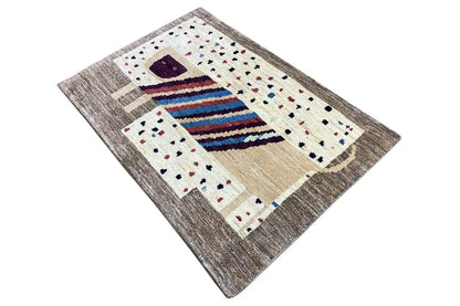Gabbeh rug 121x83 cm from above: beige surface with stripes and a dark purple square