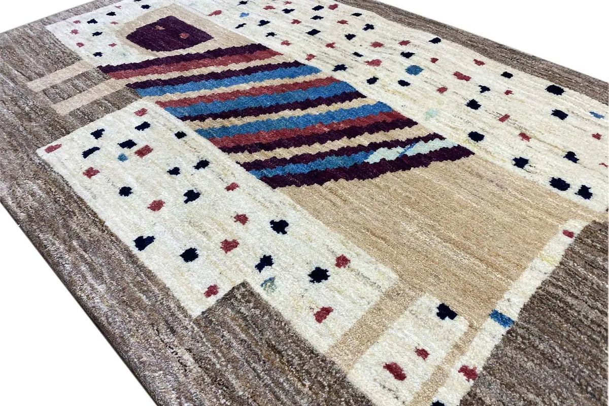 Gabbeh rug 121x83 cm close-up: stripes, dots, and beige shading in a grid