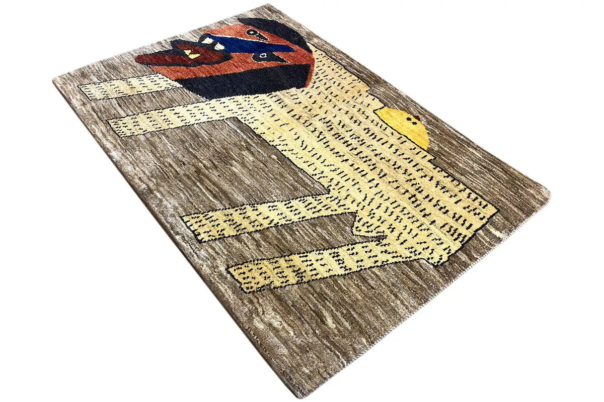 Gabbeh rug with lion ornament, gray-brown fields, and yellow zigzag line