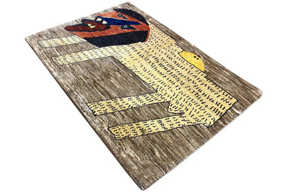 Gabbeh rug with lion ornament, gray-brown fields, and yellow zigzag line