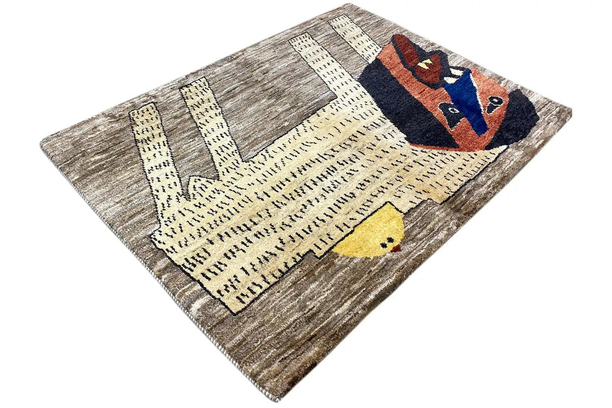 Gabbeh rug with lion's head in blue/red, light yellow areas, and gray stripe pattern