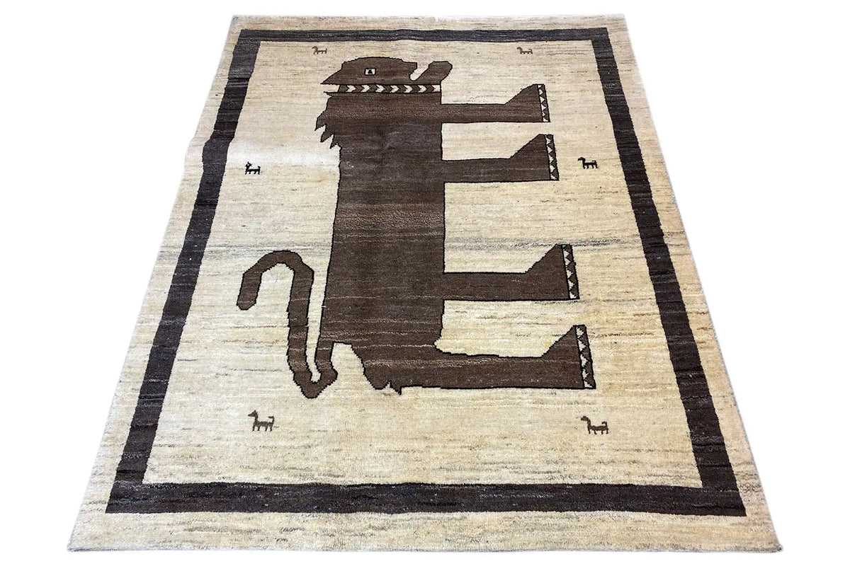 Flat Gabbeh rug, large animal/arrow central motif, light beige and dark brown, framed in black
